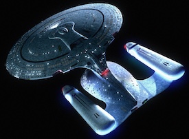 Starship with a saucer section and two warp nacelles. The warp nacelles have a blue glow. The saucer can detach.