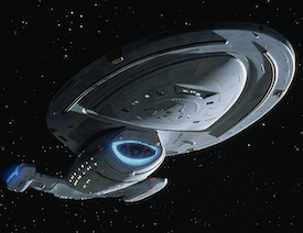 Starship with a saucer section and two warp nacelles. The warp nacelles have a blue glow. The saucer cannot detach.